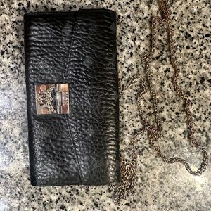 Cross body mcm purse.